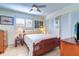 Spacious bedroom with wood bed frame and ceiling fan at 9156 142Nd St, Seminole, FL 33776