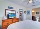 Main bedroom with dresser and en-suite bathroom at 9156 142Nd St, Seminole, FL 33776