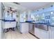 Eat-in kitchen with white cabinets and granite counters at 9156 142Nd St, Seminole, FL 33776