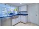 Stainless steel sink and dishwasher in a white kitchen at 9156 142Nd St, Seminole, FL 33776