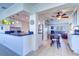 Updated kitchen with granite counters, white cabinets, and breakfast bar at 9156 142Nd St, Seminole, FL 33776