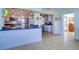Kitchen with granite counters, white cabinets, and a breakfast bar at 9156 142Nd St, Seminole, FL 33776
