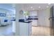 White kitchen cabinets, granite countertops, and tile floors at 9156 142Nd St, Seminole, FL 33776