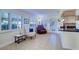 Bright living room with comfortable seating and large windows at 9156 142Nd St, Seminole, FL 33776