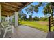 Relaxing patio with tiled flooring and backyard view at 1049 S Pointe Alexis Dr, Tarpon Springs, FL 34689