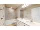 Bathroom with double vanity and bathtub at 10827 High Noon Trl, Parrish, FL 34219