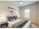Cozy bedroom with neutral decor and a ceiling fan at 10827 High Noon Trl, Parrish, FL 34219