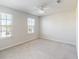 Spacious bedroom with two windows and ceiling fan at 10827 High Noon Trl, Parrish, FL 34219
