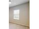 Simple bedroom with a window and neutral colored walls at 10827 High Noon Trl, Parrish, FL 34219