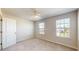 Well-lit bedroom with neutral decor and carpet at 10827 High Noon Trl, Parrish, FL 34219