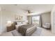 Spacious bedroom with a large bed and window at 10827 High Noon Trl, Parrish, FL 34219