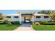 Community center with a walkway, landscaping, and gated pool access at 10827 High Noon Trl, Parrish, FL 34219