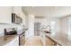 Modern kitchen with stainless steel appliances and granite countertops at 10827 High Noon Trl, Parrish, FL 34219