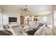 Open-concept living area with a kitchen, island, and dining space at 10827 High Noon Trl, Parrish, FL 34219