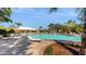 Resort-style pool with surrounding lounge chairs and patio at 10827 High Noon Trl, Parrish, FL 34219