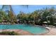 Relaxing community pool with plenty of lounge chairs at 10827 High Noon Trl, Parrish, FL 34219