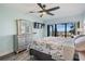Main bedroom with ocean view, king bed, and dresser at 1230 Gulf Blvd # 604, Clearwater Beach, FL 33767