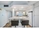 Modern white kitchen with quartz countertops and stainless steel appliances at 1230 Gulf Blvd # 604, Clearwater Beach, FL 33767