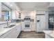 Bright kitchen with white cabinets and stainless steel appliances at 1230 Gulf Blvd # 604, Clearwater Beach, FL 33767