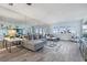 Spacious living room with large mirror and ocean view at 1230 Gulf Blvd # 604, Clearwater Beach, FL 33767