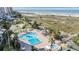 Aerial view of resort pool, hot tub, tennis court at 1230 Gulf Blvd # 604, Clearwater Beach, FL 33767