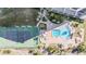 Aerial view of resort pool and tennis courts, lush landscaping at 1230 Gulf Blvd # 604, Clearwater Beach, FL 33767