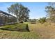 View of the backyard, showing a pond and neighboring houses at 12509 Safari Ln, Riverview, FL 33579