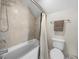 Simple bathroom with shower/tub combo and tile surround at 12527 Pompanic St, San Antonio, FL 33576