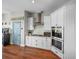 Well-equipped kitchen showcasing stainless steel appliances and white shaker cabinets at 12527 Pompanic St, San Antonio, FL 33576