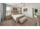 Bright and airy main bedroom with king-size bed and walk-in closet at 12626 Tahitian Pearl Cir, Parrish, FL 34219