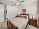 Well-lit bedroom with double bed, nightstands and dresser at 12626 Tahitian Pearl Cir, Parrish, FL 34219