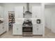 Modern kitchen with white cabinets, stainless steel appliances, and a pantry at 12626 Tahitian Pearl Cir, Parrish, FL 34219