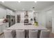 Modern kitchen boasts white cabinets, large island, and stainless steel appliances at 12626 Tahitian Pearl Cir, Parrish, FL 34219