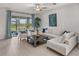 Spacious living room with sectional sofa and sliding glass doors at 12626 Tahitian Pearl Cir, Parrish, FL 34219