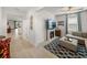 Spacious living room with a sectional sofa, fireplace, and large TV at 12626 Tahitian Pearl Cir, Parrish, FL 34219