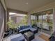 Relaxing screened patio with seating area and outdoor grill at 12626 Tahitian Pearl Cir, Parrish, FL 34219