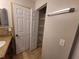 Bathroom with linen closet and granite vanity at 12908 Brant Tree Dr, Riverview, FL 33579