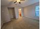 Spacious bedroom with ceiling fan and access to bathroom at 12908 Brant Tree Dr, Riverview, FL 33579