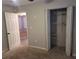 Bedroom with carpet, double door closet and door to another room at 12908 Brant Tree Dr, Riverview, FL 33579