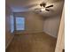Main bedroom with ceiling fan and sliding glass doors at 12908 Brant Tree Dr, Riverview, FL 33579