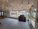 Covered back patio with string lights, offering a relaxed outdoor living space and views of the backyard at 12908 Brant Tree Dr, Riverview, FL 33579