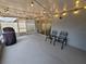 Screened patio features string lights and a grill at 12908 Brant Tree Dr, Riverview, FL 33579