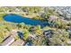 Aerial view showcasing home near a peaceful lake at 131 Mystic Lake N Dr, St Petersburg, FL 33702