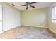 Spacious bedroom with tiled floors and ceiling fan at 131 Mystic Lake N Dr, St Petersburg, FL 33702