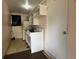 Compact kitchen equipped with a gas stove and essential storage at 1319 Vance Rd, Plant City, FL 33566