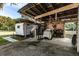Rustic workshop with covered area and vintage camper at 1319 Vance Rd, Plant City, FL 33566