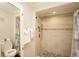 Modern bathroom with a pebble-floored shower, tiled walls, and neutral accents for a spa-like feel at 1330 70Th N St, St Petersburg, FL 33710