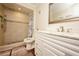 Updated bathroom featuring a walk-in shower, updated vanity, and decorative tile accents at 1330 70Th N St, St Petersburg, FL 33710