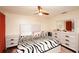Comfortable bedroom with ceiling fan, neutral walls, and a large dresser set at 1330 70Th N St, St Petersburg, FL 33710