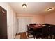 This dining room has a dark wood table and is illuminated by flush mount lights at 1330 70Th N St, St Petersburg, FL 33710